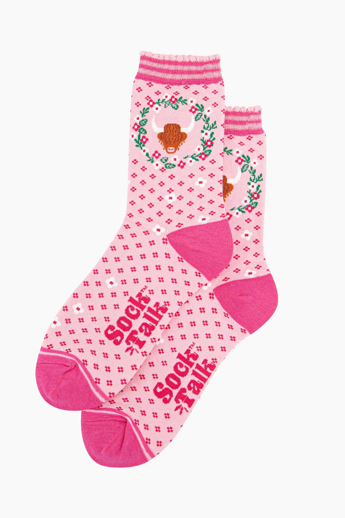 womens-bamboo-socks-pink-highland-cow-wreath-laying-flat-floral-pattern