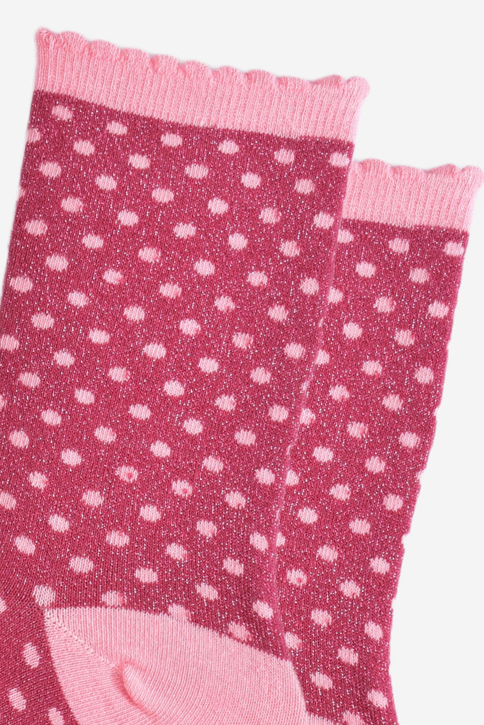 close up of the small polka dot print pattern and all over silver sparkle on the ankle socks