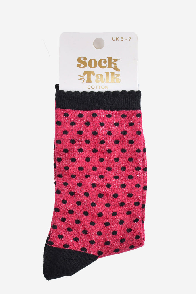 hot pink and black polka dot glitter socks in their sock talk packaging, the socks are a uk size 3-7