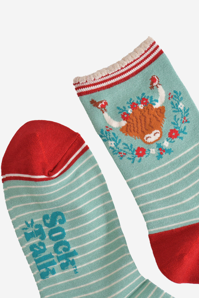 close up of the toe and cuff of the bamboo socks, the toe is red and the cuff is scalloped with red and cream stripes