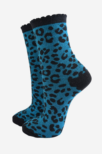 teal ankle socks with a black leopard print pattern, all over glitter sparkle and black scalloped cuff