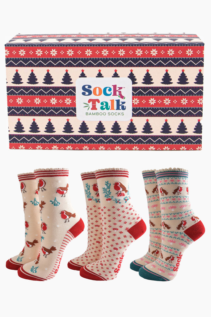 three pairs of cream and red bamboo socks featuring red robins and holly in a fair isle inspired christmas tree pattern gift box