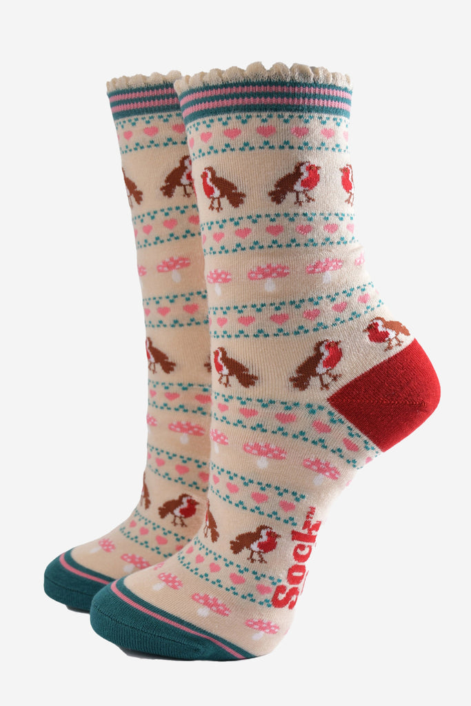 cream bamboo socks with a fair isle style pattern featuring red robin birds, pink toad stools and pink love hearts