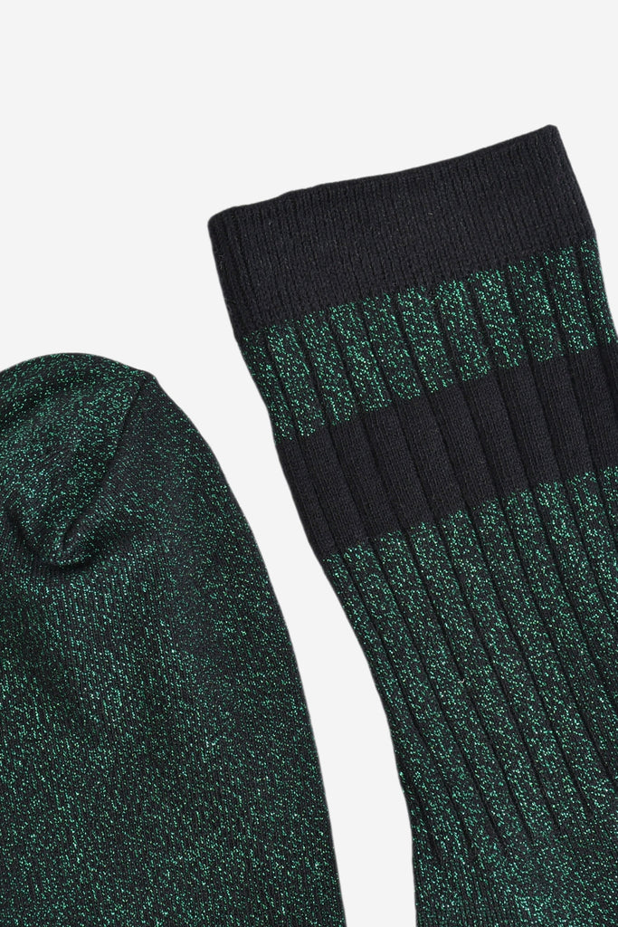 close up of the toe and cuff. the toe is green with silver glitter the same as the base of the socks. the cuff is black and without glitter.