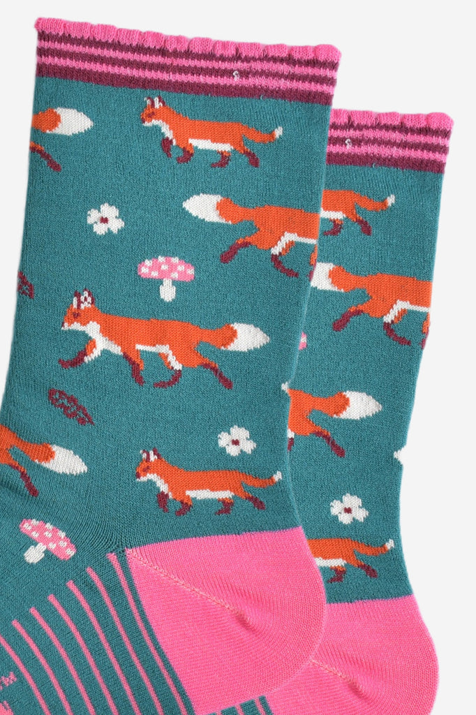 close up of the fox, toadstool and floral pattern on the socks