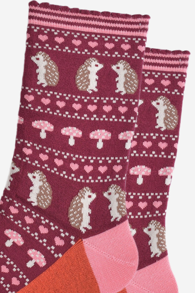 close up of the fair isle style design, showing hedgehogs, toadstools and love hearts in defined rows