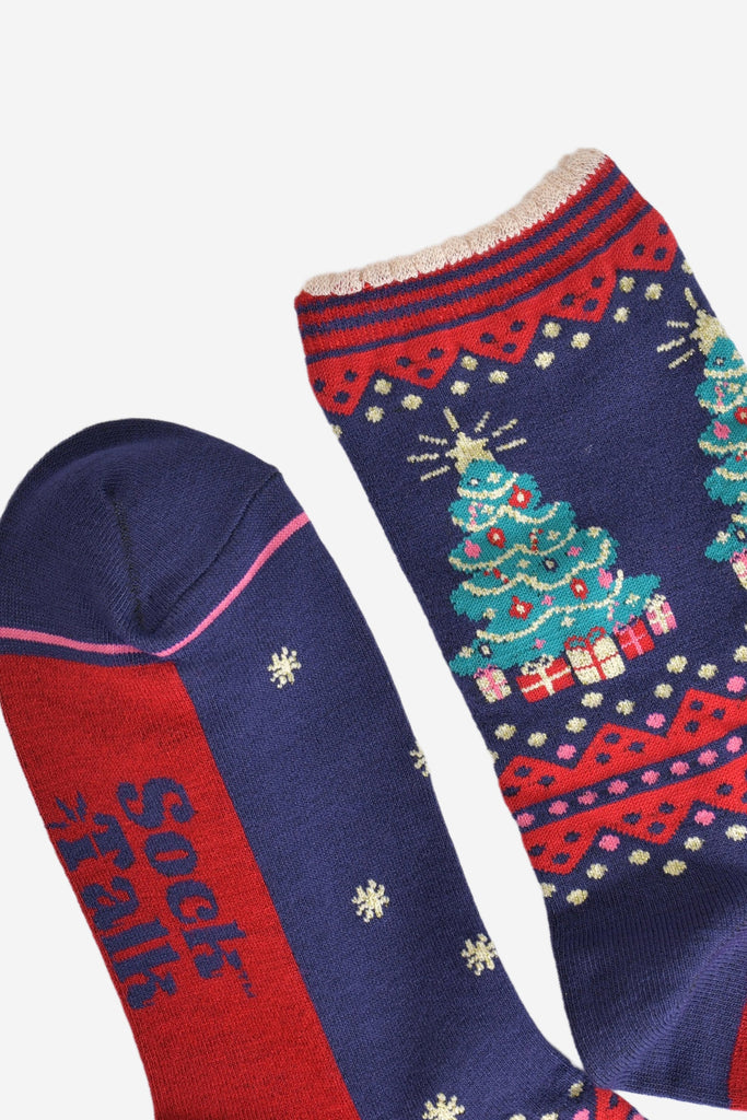 close up of the toe and cuff, the toe is navy blue a hot pink contrasting border stripe, the cuffs are scalloped and are red and navy blue striped