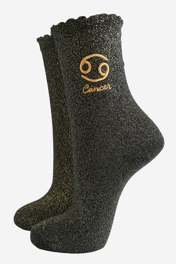 black and gold sparkly ankle socks with a scalloped cuff and an gold embroidered cancer zodiac symbol and name