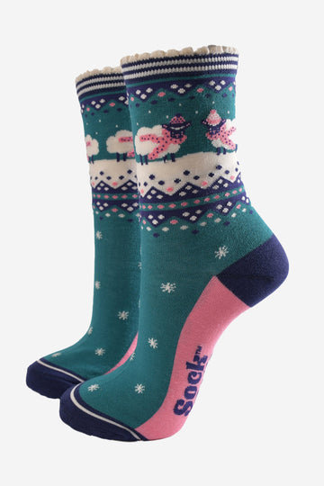 green, blue and pink ankle socks with sheep wearing cosy winter scarves and hats