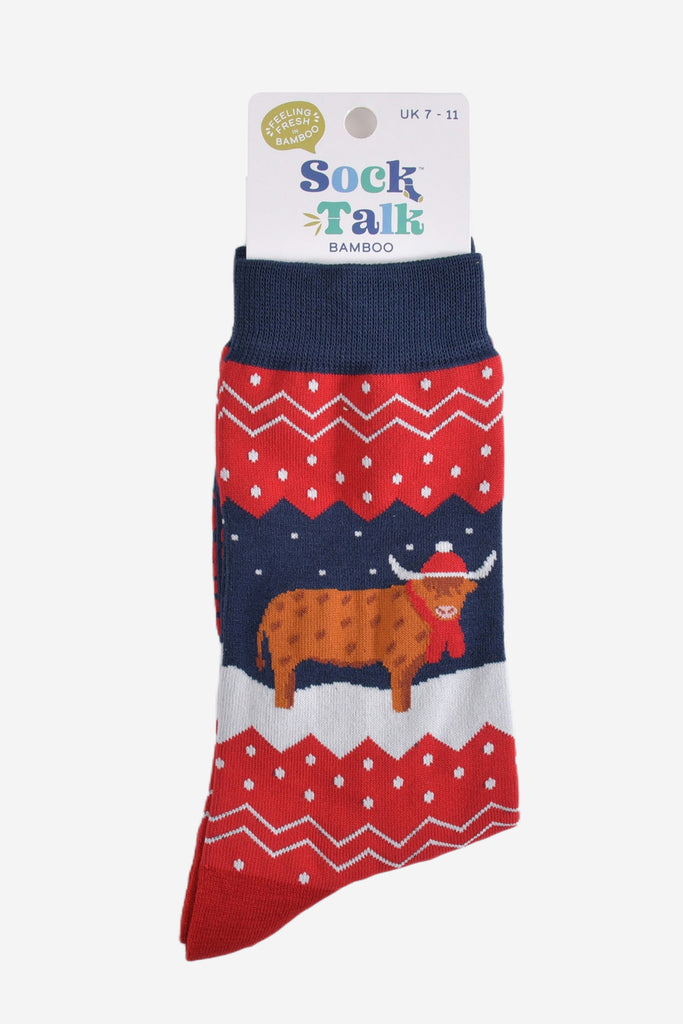 navy blue and red fair isle highland cow socks in their sock talk packaging, these socks are a uk size 7-11