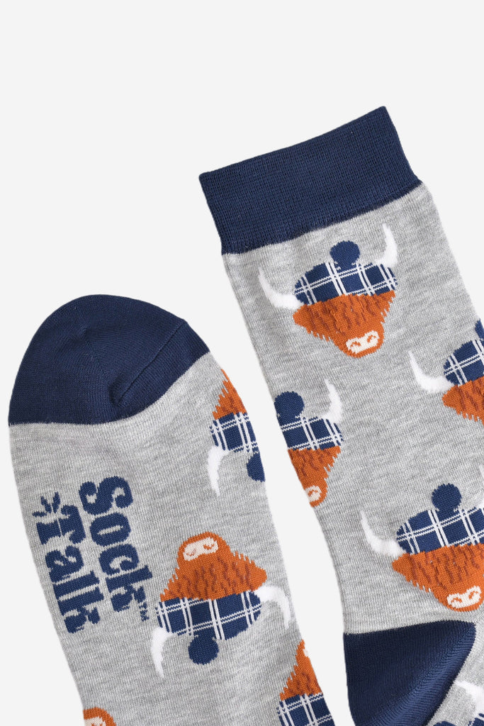 showing the toe and cuff of the grey and navy blue scottish highland cow socks