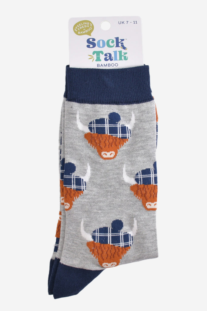 grey and navy blue highland cow socks with their sock talk packaging, these socks are uk size 7-11