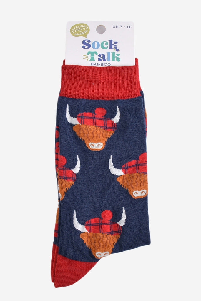 red and navy blue highland cow socks with their sock talk packaging, these socks are uk size 7-11