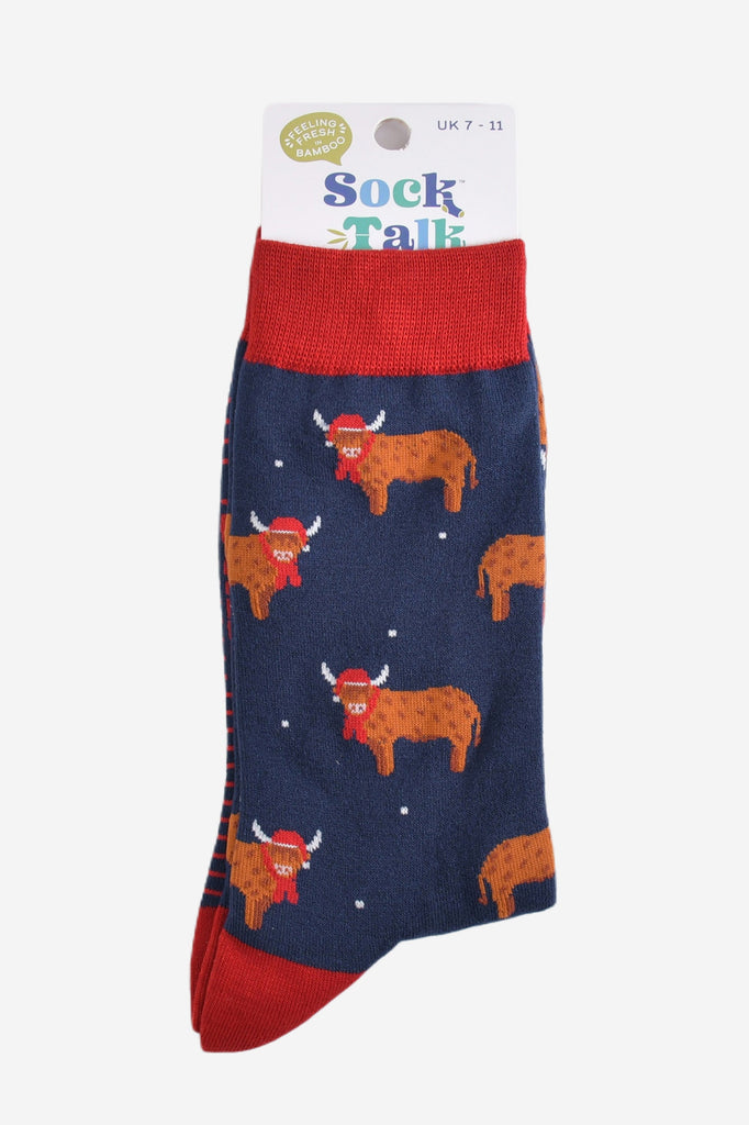 navy blue and red highland cow bamboo socks in their sock talk packaging, these socks are uk size 7-11