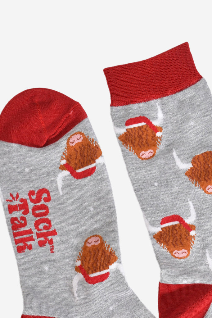 a close up of the heel and cuff of the socks, showing the all over highland cow pattern