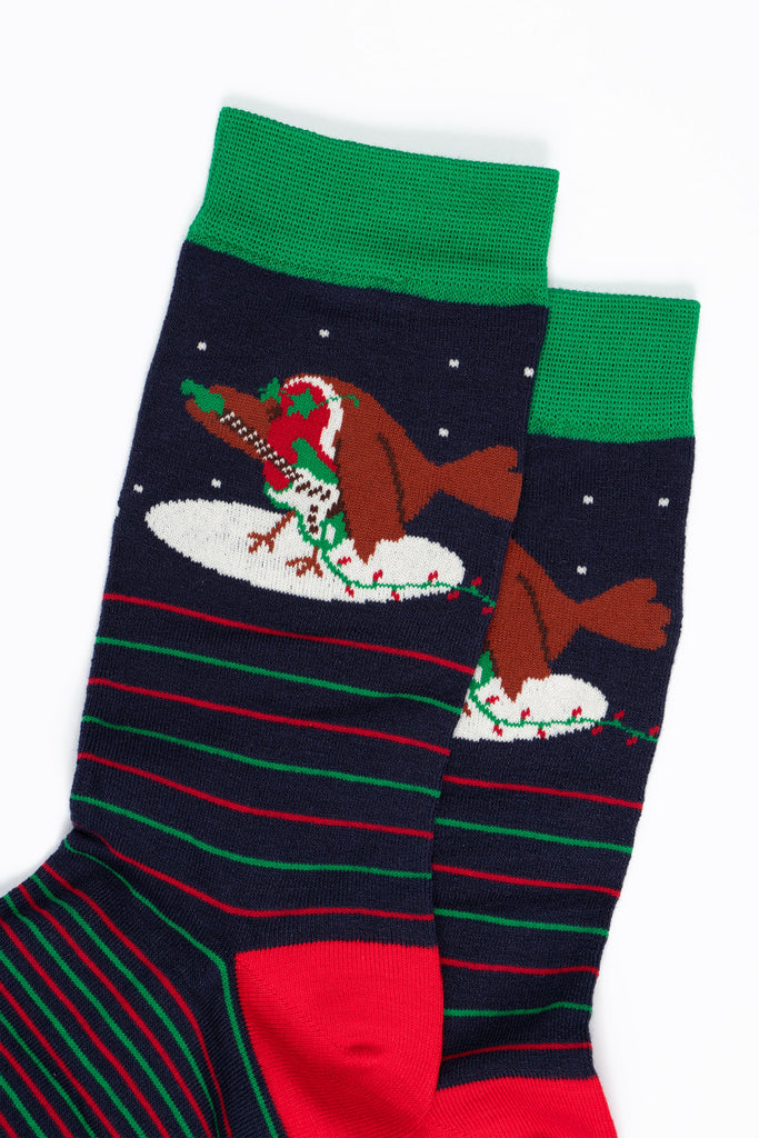 close up of the rockin robin, the robin is standing in a spotlight and playing a green electric guitar, like a rock star the robin is also wearing green sunglasses