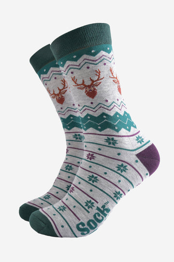 grey and green fair isle style bamboo socks featuring snowflakes and stags