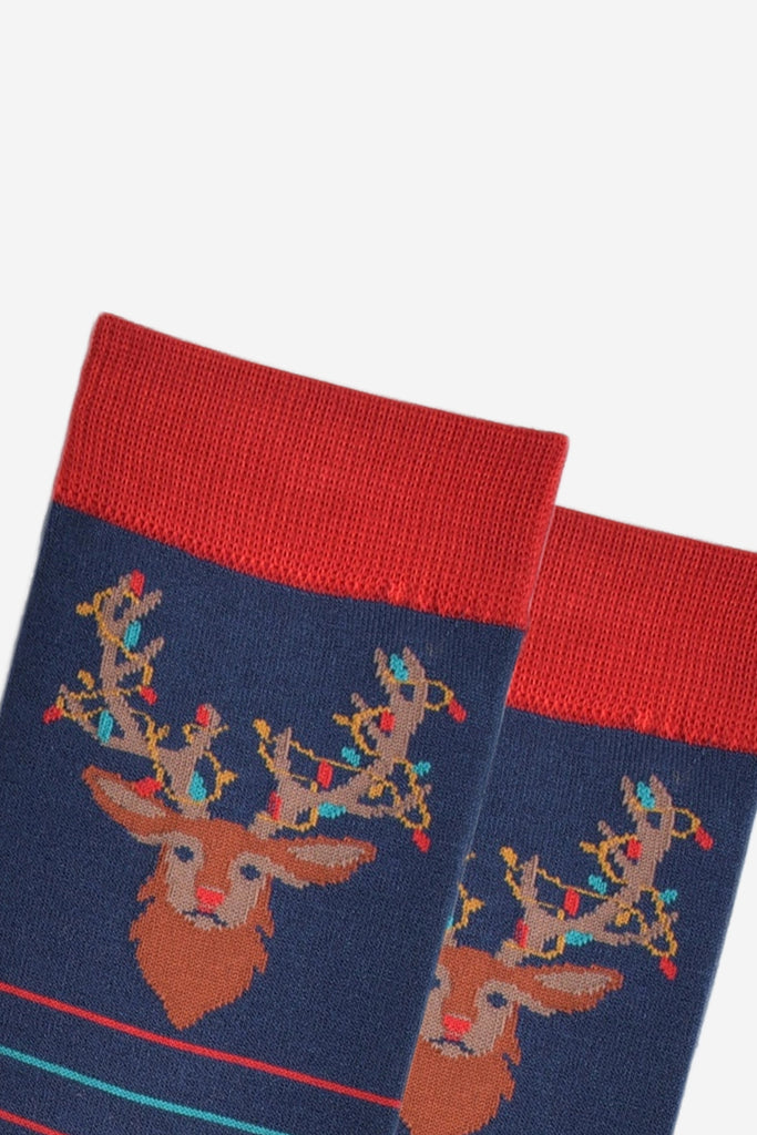 close up of the stag head design on the ankle of the socks, showing the festive party lights entangled in its antlers