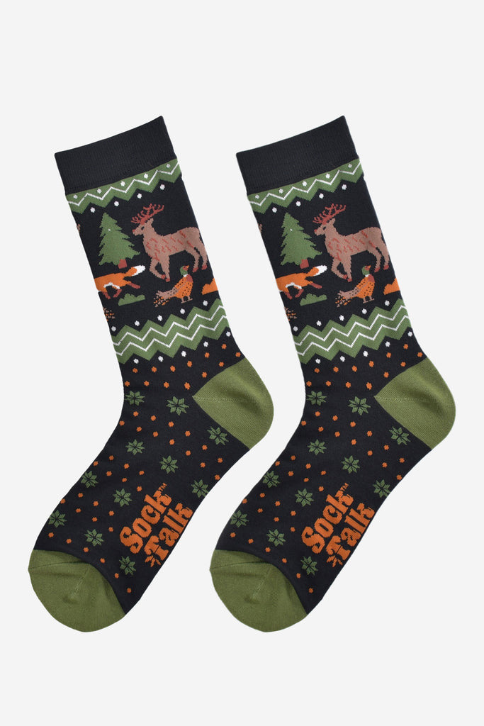 woodland animal bamboo socks laying flat, showing the fair isle pattern and the stag, fox, pheasant and tree pattern on the ankles