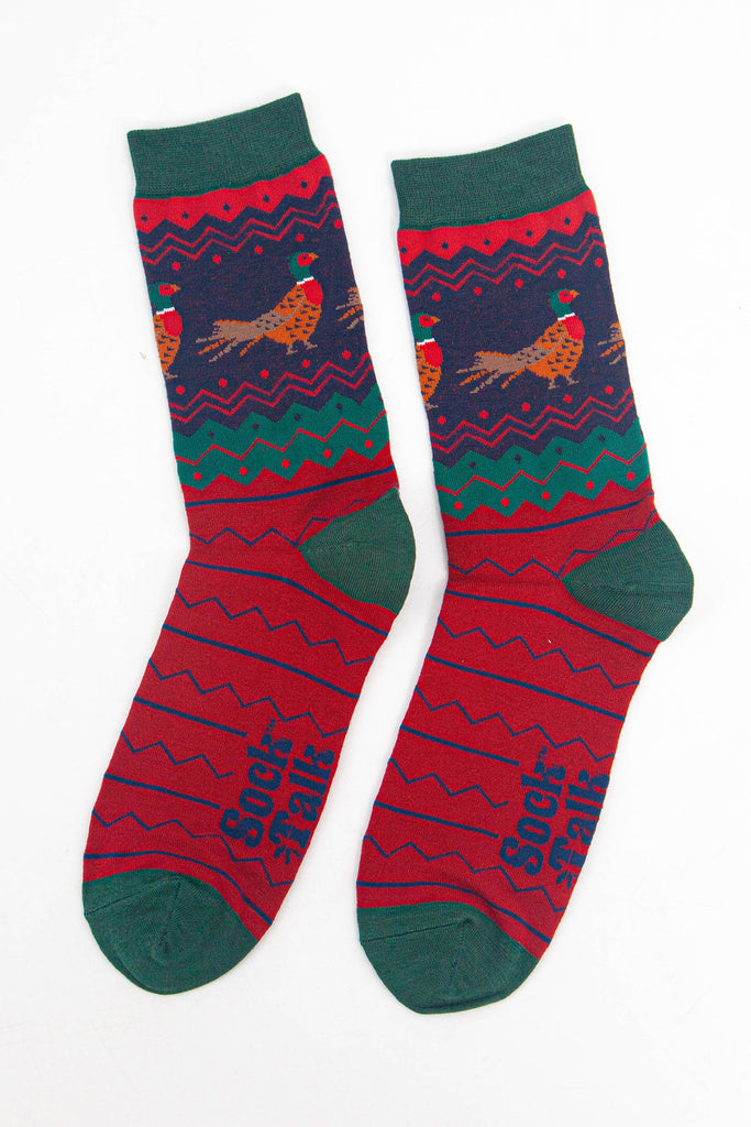 showing the fair isle pheasant socks laying flat, highlighting the all over pattern and the pheasants on the ankles of the socks.