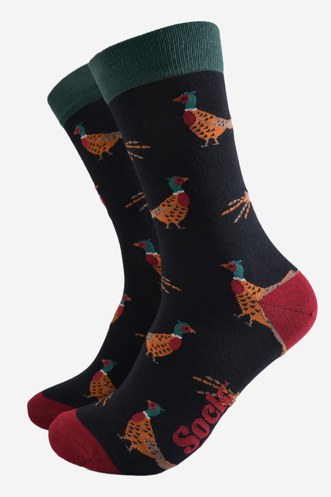 black socks with a pattern of classic woodland pheasants with contrasting red and green heel toe and cuff