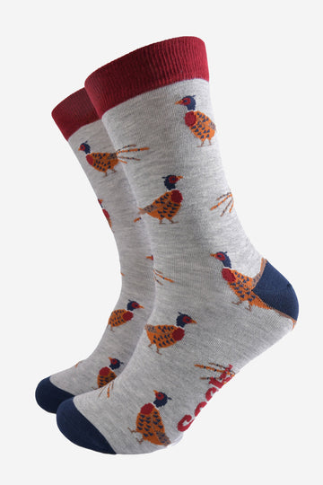 light grey socks with a pattern of classic woodland pheasants with contrasting red and navy blue heel toe and cuff