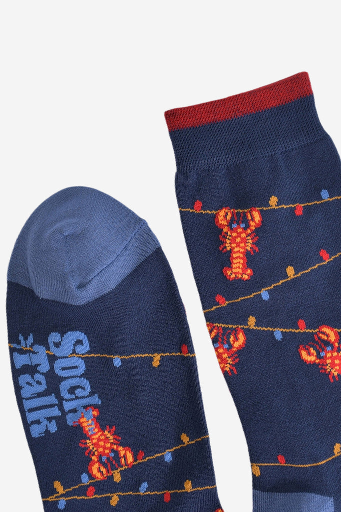 showing the toe and cuff of socks, the cuff has a small contrasting burgundy stripe, the toe is light blue