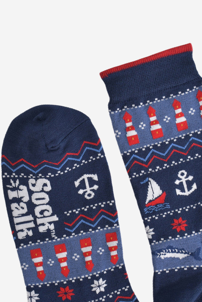 showing the toe and cuff of the fair isle nautical socks, the cuff has a subtle burgundy stripe on the edge, the toe is plain navy blue