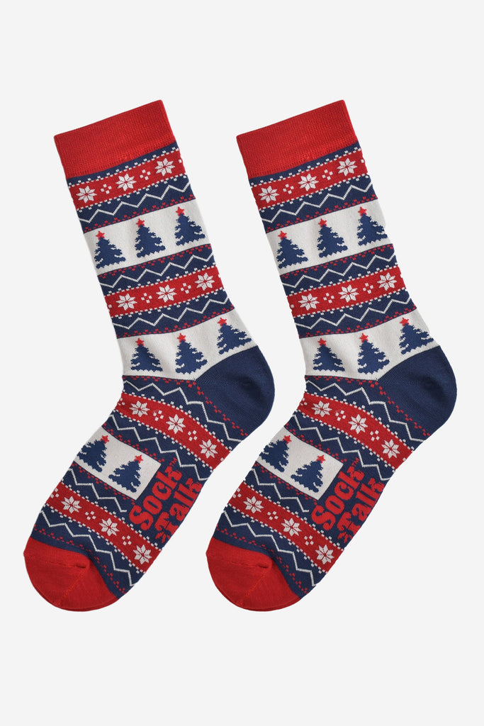 fair isle christmas tree socks laying flat, showing the all over pattern featuring snow flakes, xmas tress and zig zag patterns