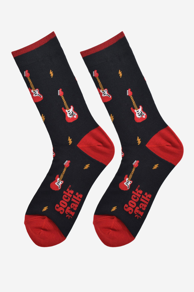 red and black electric guitar bamboo socks laying flat, showing the all over pattern of guitars and yellow lightning bolts