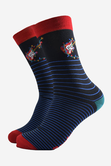 black socks with a blue horizontal pinstripe featuring a red eclectic guitar and festive xmas lights on the ankle