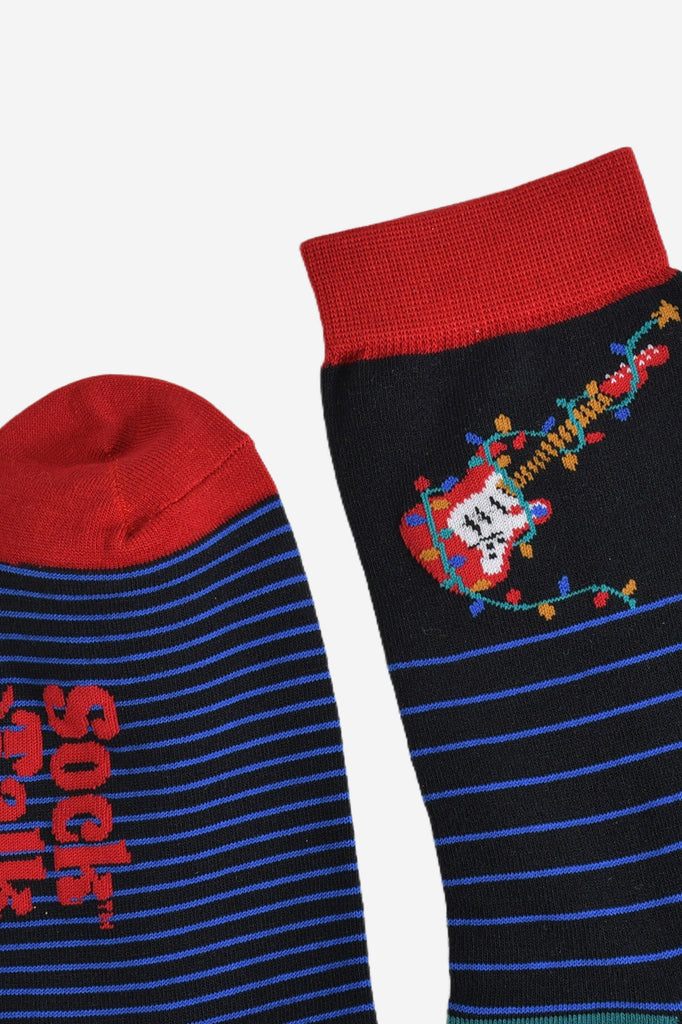 close up of the cuff and toe of the socks, both are red in contrast to the black and blue of the socks