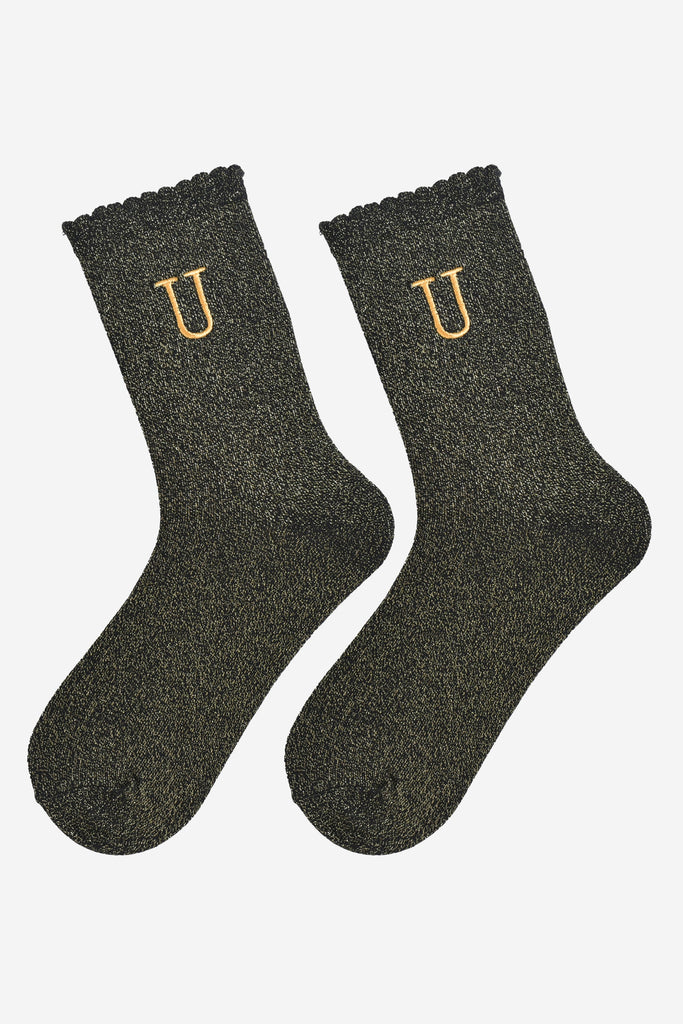 showing the glitter socks laying flat, they have a scalloped cuff and an all over gold sparkle