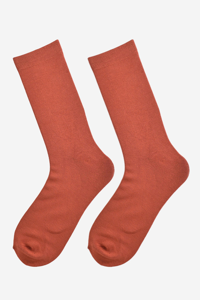 rust orange bamboo socks laying flat, showing the all over consistent colour