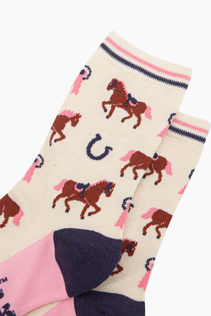 womens-bamboo-socks-cream-horse-riding-close-up-horses-wearing-saddles-and-bridles-pink-eventing-rosettes-large-horseshoes