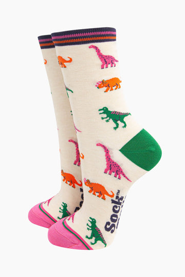 womens-bamboo-socks-cream-multi-dinosaurs-pattern-trex-brontosaurus-triceratops-bright-colours-pink-orange-green-on-cream-background