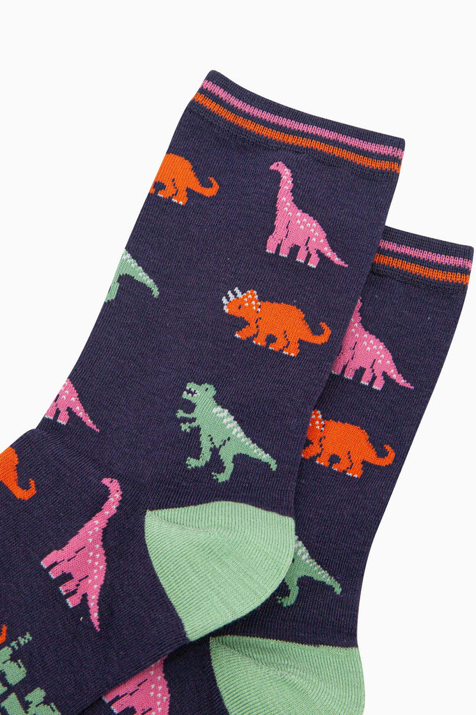 womens-bamboo-socks-navy-multi-dinosaurs-close-up-pink-brontosaurus-orange-triceratops-green-t-rex-orange-and-pink-striped-cuff