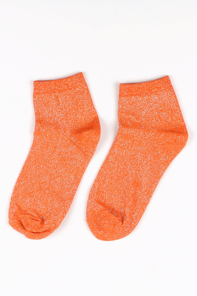 orange anklet socks laying flat, showing the all over glitter pattern