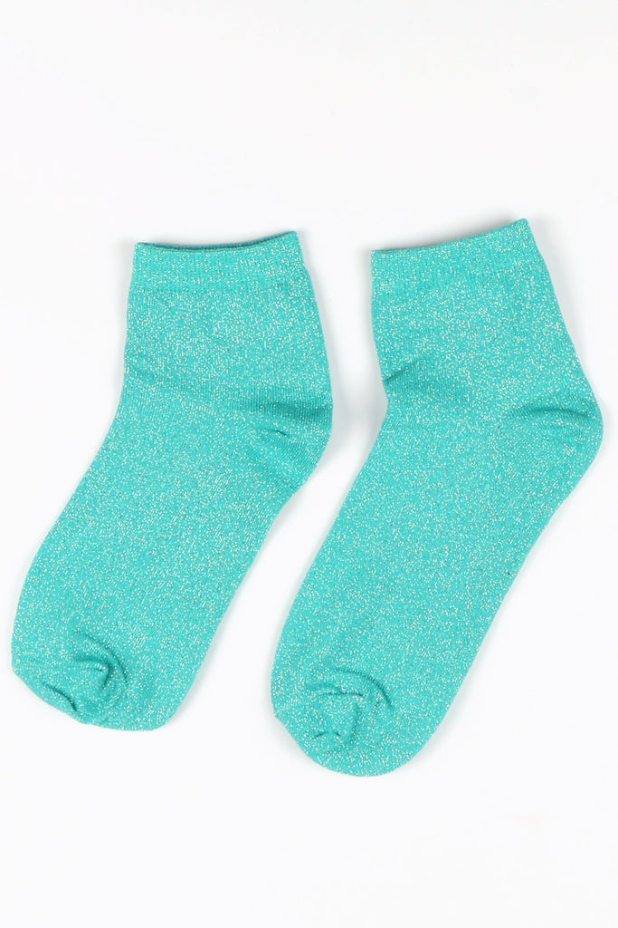 turquoise anklet socks laying flat, showing the all over glitter pattern