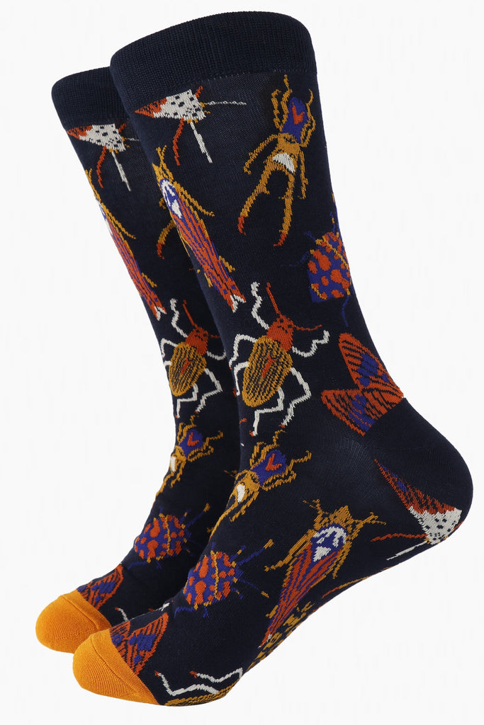 navy blue and mustard yellow bamboo socks with an all over pattern of beetles, bugs and insects