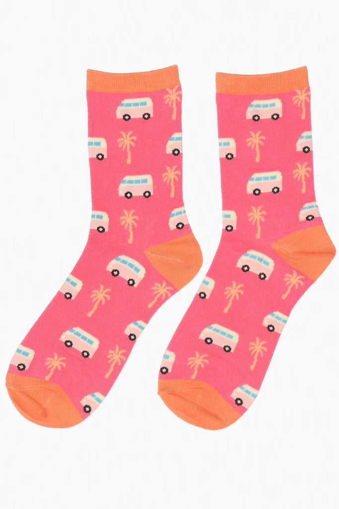 pink and orange bamboo socks featuring a pattern of vintage campervans and summer palmtrees