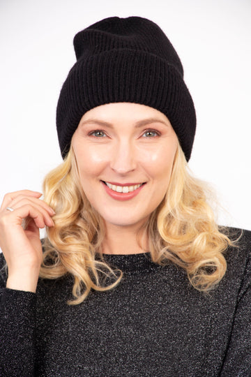 model wearing a plain black winter beanie hat