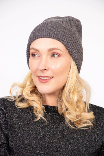 model wearing a dark grey winter beanie hat