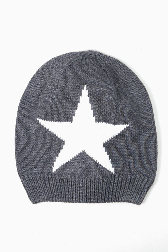 dark grey beanie knitted hat with a large white five pointed star on the front. the star is knitted into the design.