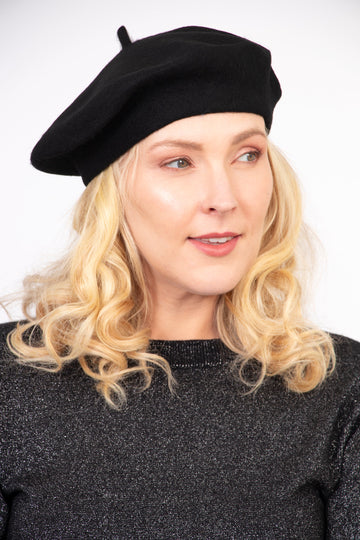 model wearing a black wool blend french beret hat