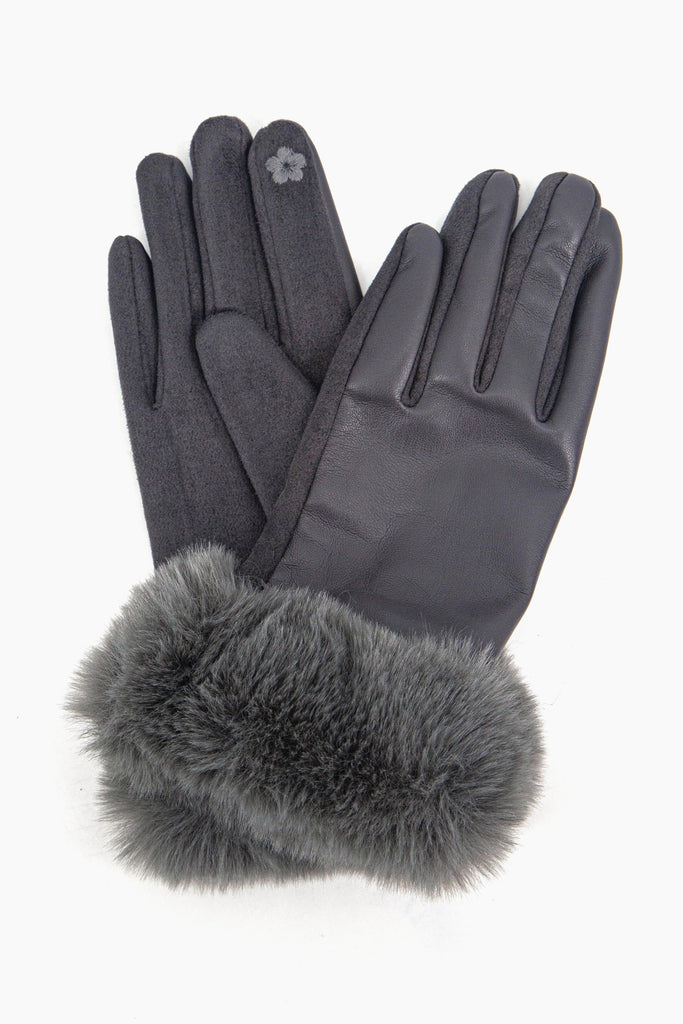 a close up of the faux leather winter gloves showing up close the faux fur trim around the wrists.