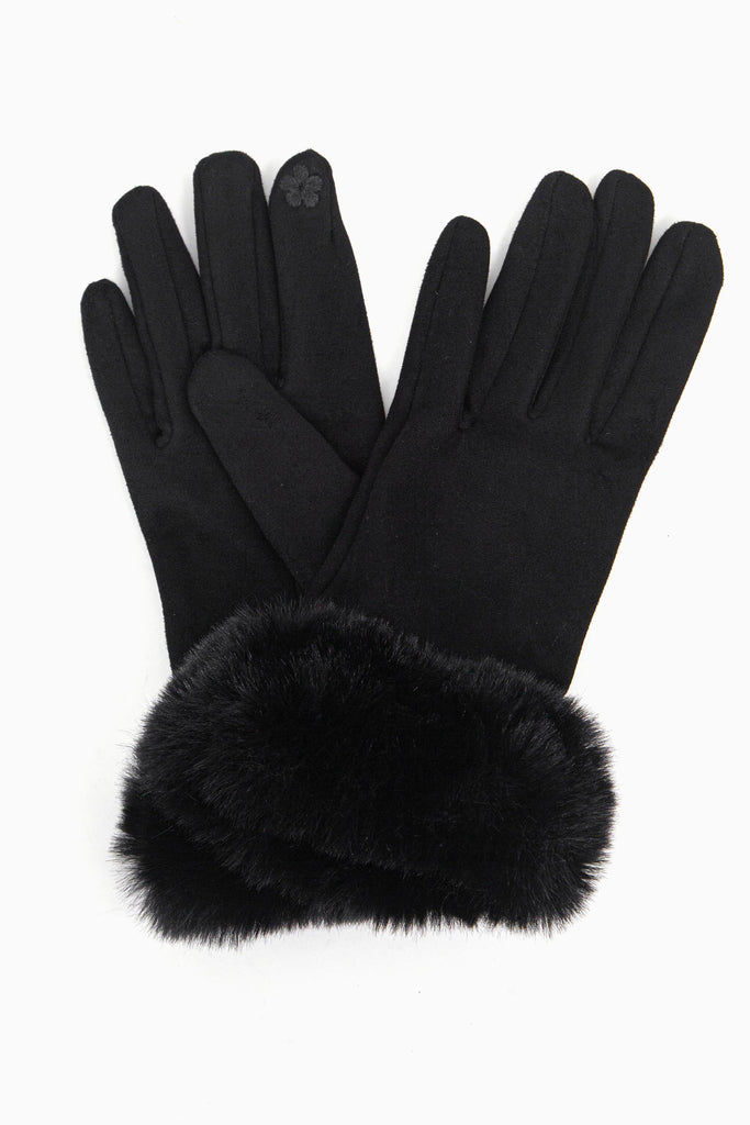 a close up of the velvet winter gloves showing up close the faux fur trim around the wrists.