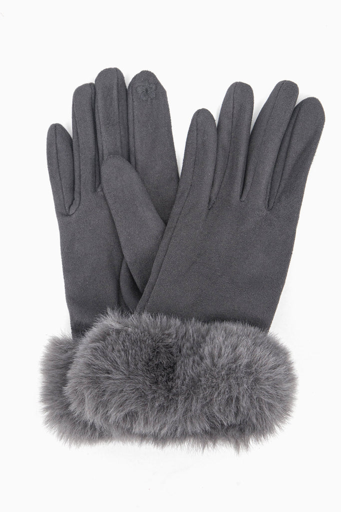 a close up of the velvet winter gloves showing up close the faux fur trim around the wrists.