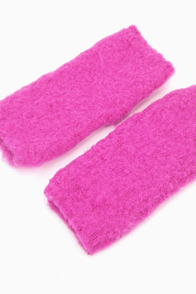 side view of the knitted wrist warmers, showing the opening at each end