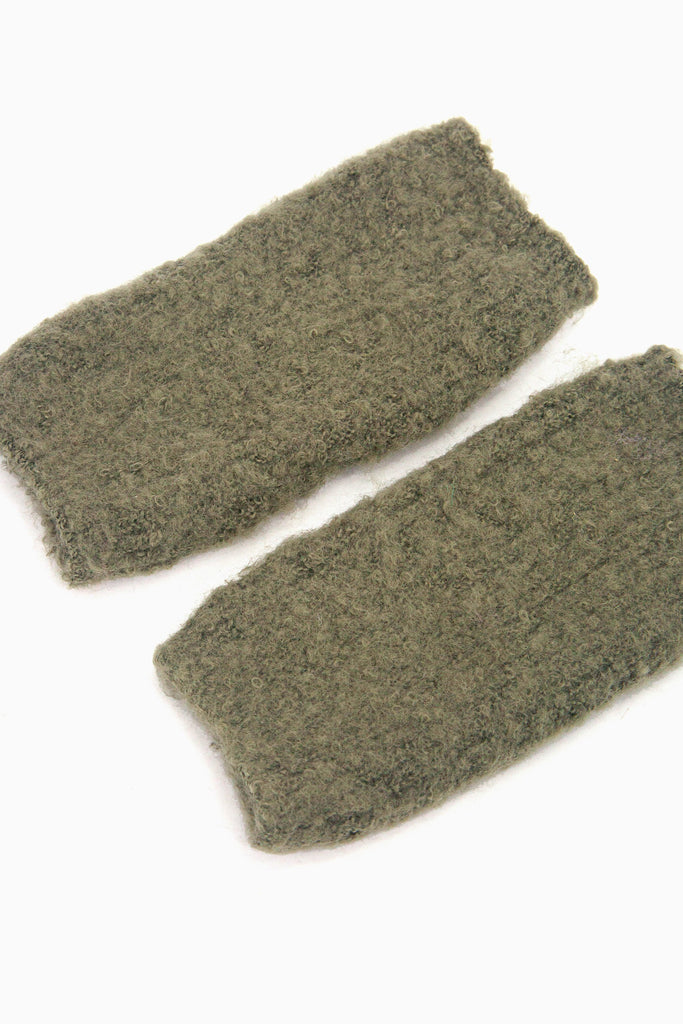 side view of the knitted wrist warmers, showing the opening at each end